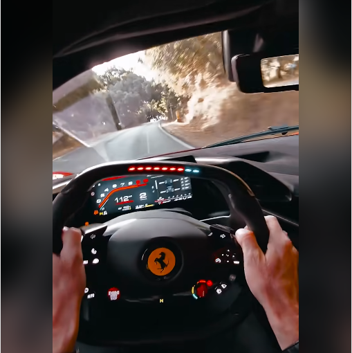 Ferrari steering wheel showing embedded RPM shift lights in context while driving